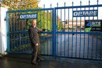 Chris Wise, Optare’s commercial director and longest serving employee shuts the gates of Crossgates works in Leeds