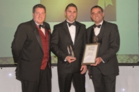 Richard Greay (centre) accept the award at the East Cambridgeshire Business Awards
