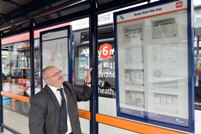 Cllr Keith Linnecor, Centro’s Lead Member for the Transport Network with the e-paper screen at the bus stop in Halesowen Street, Oldbury