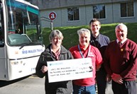 Pic cap: Pictured presenting the cheque for £1,4081 are: Mid Wales Travel's Debbie Jenkins, Aneurin Roberts of Wales Air Ambulance, Mateusz Lukasiak of Aberystwyth University Students Union and Mid Wales Travel's Mel Evans. MID WALES TRAVEL