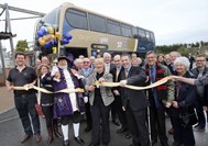 Exmouth Mayor Maddy Chapman cuts the ribbon alongside Exmouth Town Crier Roger Bourgein and Stagecoach SW Managing Director Bob Dennison