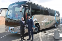 ADL’s Simon Wood hands over a new Plaxton Panther Volvo B8R to Yasar Aziz, Transport Manager with Aziz Coach Service Limited