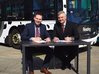 Martijn Gilbert, CEO of Reading Buses, with Mark Oliver, UK Bus & Coach Fleet Sales General Manager for Scania (Great Britain) Ltd, in front of the company's 'Bus Hound' gas bus?