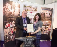 Malcolm Roughead OBE, Chief Executive of Visit Scotland, with Lynda Denton of Gretna Green Famous Blacksmiths Shop at the recent Visit Scotland expo