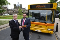 Andrew Jones MP and Transdev CEO Alex Hornby, pictured with a distinctively liveried Little Explorers Dennis Dart