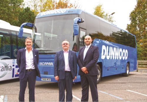 Dunwood Travel: Dunwood Travel Directors Phil Westwood and Colin Duncan with Scania Regional Account Manager Lee Wale, receiving their 49-seater Scania Touring