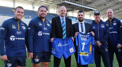Ian Brooksbank, Head of Commercial Finance at Arriva Bus and Coach, and Aykan Cavlak, Temsa UK Sales Manager, celebrate the sponsorship deal with Rhinos players Tui Lolohea, Konrad Hurrell, Carl Ablett, and Head Coach David Furner