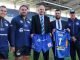 Ian Brooksbank, Head of Commercial Finance at Arriva Bus and Coach, and Aykan Cavlak, Temsa UK Sales Manager, celebrate the sponsorship deal with Rhinos players Tui Lolohea, Konrad Hurrell, Carl Ablett, and Head Coach David Furner