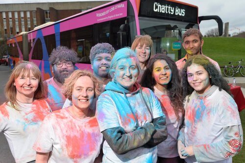 Brighton & Hove Buses' staff, Impetus volunteers and artist Lois O'Hara (centre) with the Citaro