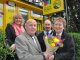 Yellow Buses’ driver Sue Levell is presented with a bouquet of flowers by grateful passenger Colin Perry with Dave Taylor, Supervisor, and Fiona Harwood, Marketing Sales Manager