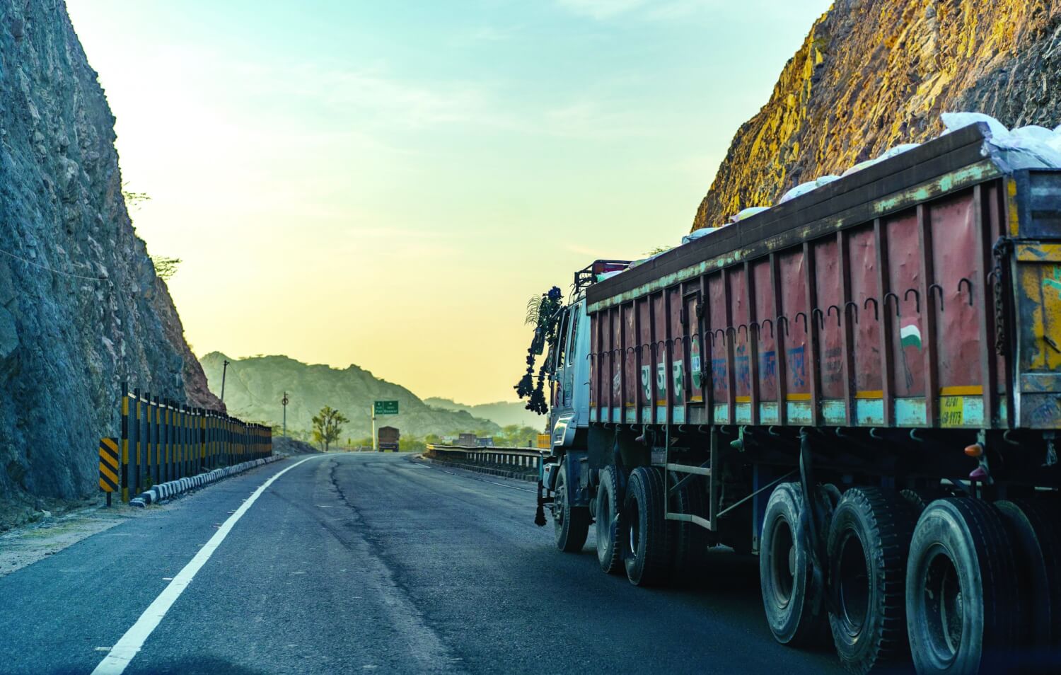Lorries commonly get in the outside lane on India’s highways and stay there. Photo – Alin Andersen via Unsplash